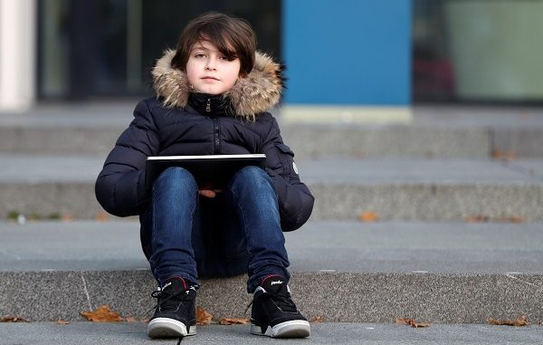 Nine-year-old Belgian student Laurent Simons, who studies electrical engineering and who will soon become the youngest university graduate in the world, poses at the University of Technology in Eindhoven, Netherlands November 20, 2019. Picture taken November 20, 2019